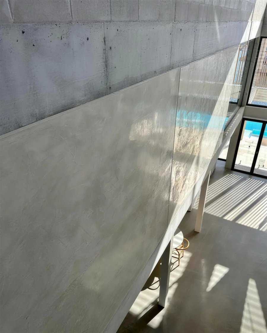 Polished plaster fireplace wall with a marble-like finish